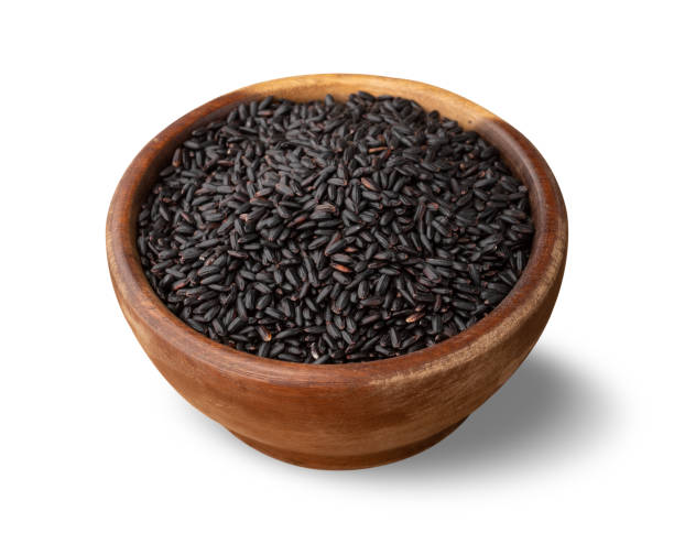 istock Raw black rice in a bowl isolated over white background 1433151589