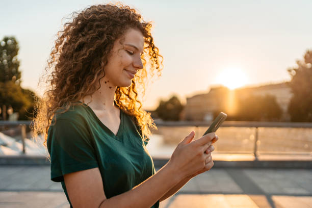 istock Young Woman Using Phone On The Bridge 1433152893