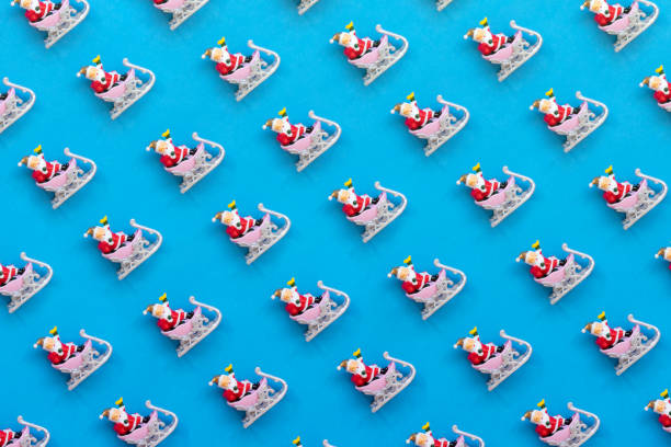 istock Santa Claus in a Row on Blue Background 1433154664