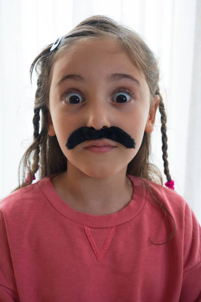 istock Mustached Little Girl 1433155375