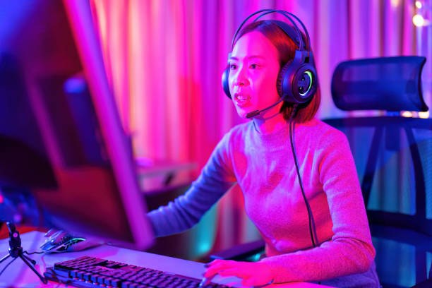 istock At home game player wearing headset have fun play battle streaming online game competition and express emotion excited talking to the team via microphone 1433156992