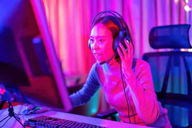 istock At home game player wearing headset have fun play battle streaming online game competition and express emotion excited talking to the team via microphone 1433157333