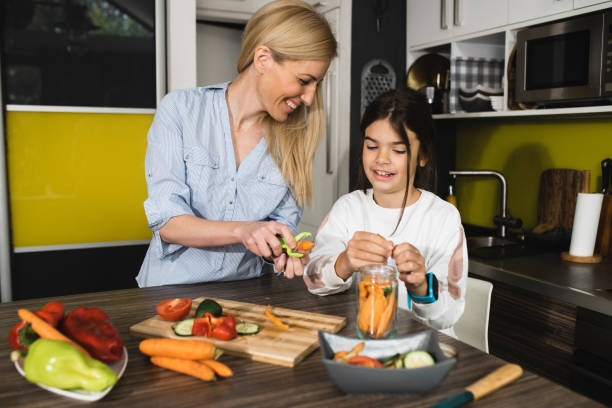 istock Happy mother enjoying in breakfast with her small daughter 1433158532