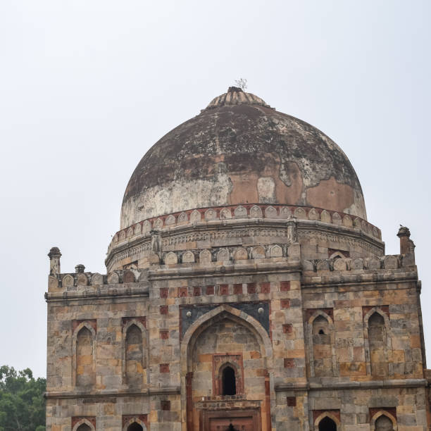 istock Mughal Architecture inside Lodhi Gardens, Delhi, India, Beautiful Architecture Inside the The Three-domed mosque in Lodhi Garden is said to be the Friday mosque for Friday prayer, Lodhi Garden Tomb 1433158676
