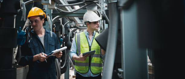 istock Engineer and team examining the air conditioning cooling system of a huge building or industrial site. 1433159251