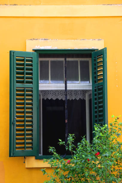 istock Green Window and Yellow Wall 1433160086
