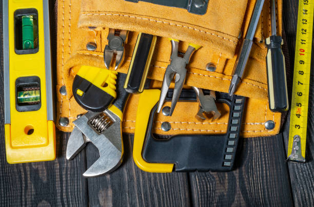 istock Tools in the bag for master builder on a wooden black vintage background 1433166841