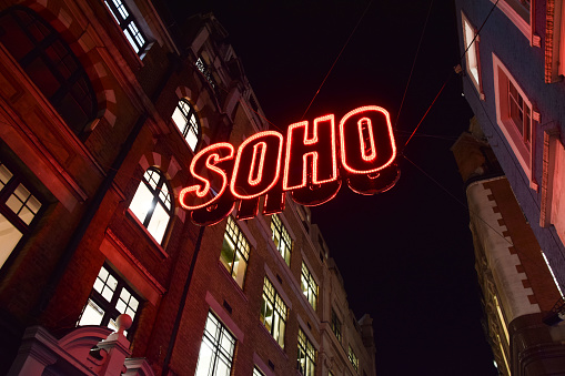 London, UK - November 25 2021: Soho neon sign in London's famous Soho, West End, at night
