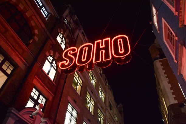 Soho neon sign in London London, UK - November 25 2021: Soho neon sign in London's famous Soho, West End, at night Drag Shows the Soho district stock pictures, royalty-free photos & images
