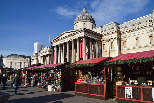 London, UK - November 18 2021: Christmas market stalls at Trafalgar Square, daytime view