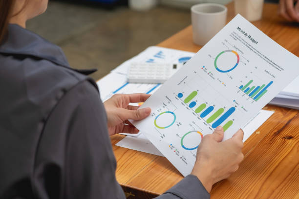 istock Two male and female marketers use company documents and use laptop computers to record data to analyze company profits. 1433168366