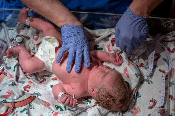 istock Nurse measuring infant baby's head 1433168726