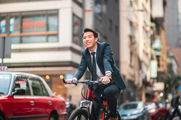 istock Handsome Young Asian Male Finance Manager Commuting With A Bicycle 1433169708