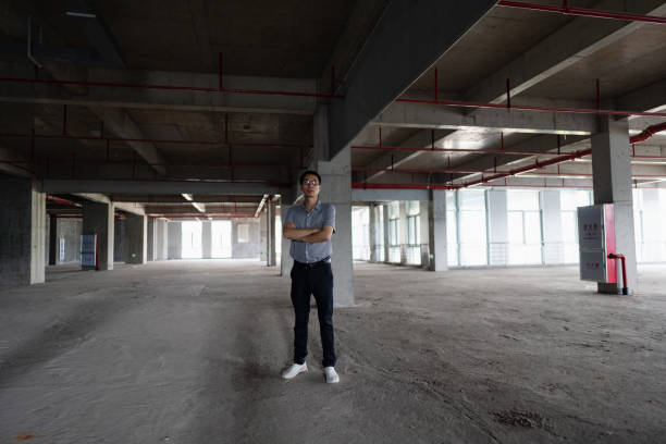 Business man standing in unfurnished office