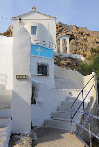 White church and stairs leading to venetian fort at harbor of Myrina, Lemnos (Limnos) island, Aegean Sea, Greece