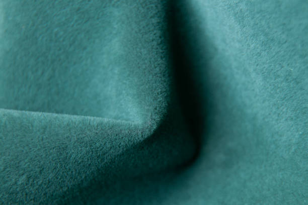 istock Green fabric as a background, velor soft fabric, green wrinkled fabric 1433173873