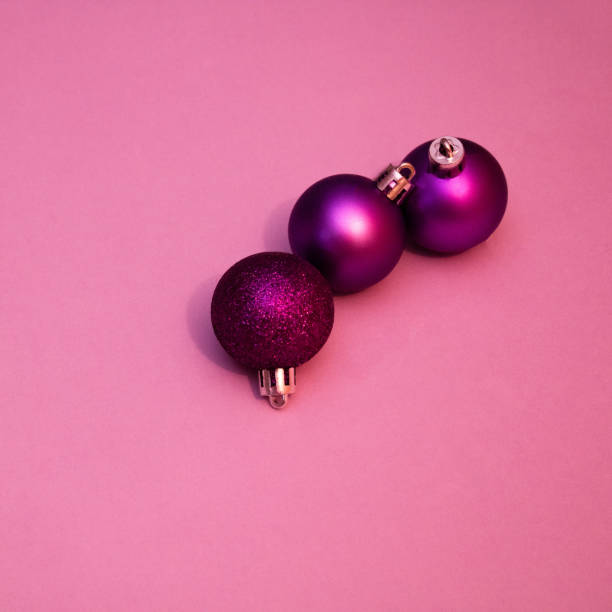 istock New Year's and Christmas decorative balls on pink background. 1433174064
