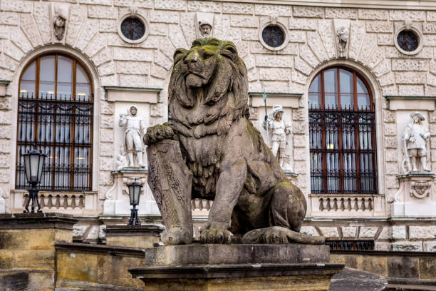 Statue of a lion with a shield at National Library, Vienna, Austria