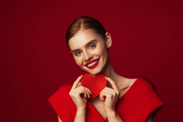 istock Beautiful emotional woman holding present box 1433179180
