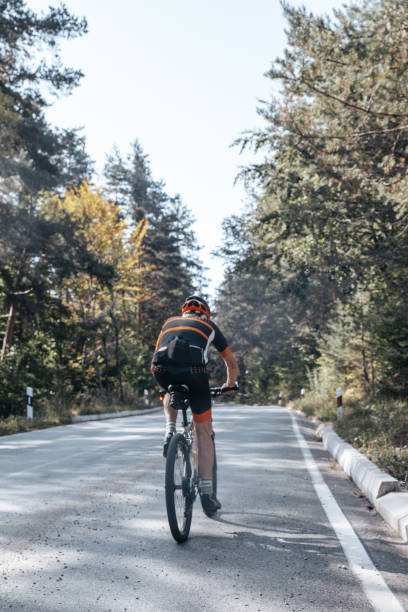 istock Man in his 80's cycling in the mountains 1433185728
