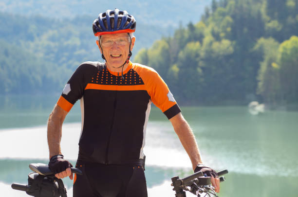 istock Man in his 80's cycling in the mountains 1433185875