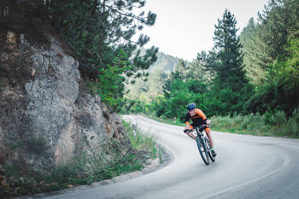 istock Man in his 80's cycling in the mountains 1433186227