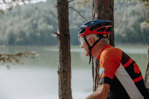 istock Man in his 80's cycling in the mountains 1433187072