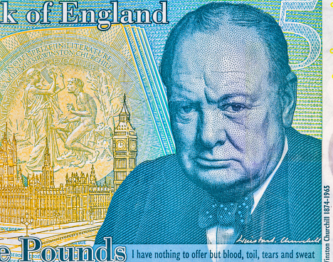 British five pounds sterling banknote closeup. Portrait of Sir Winston Churchill, Prime Minister of the United Kingdom.