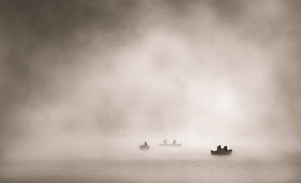 Early morning fishing boat in cloud, Rocky Valley Dam, Falls Creek Victorian High Country