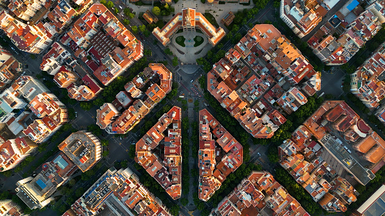 The grid was created by Ildefons Cerdà a Spanish architect to solve Barcelona's health and overcrowding problems of the 19th century.