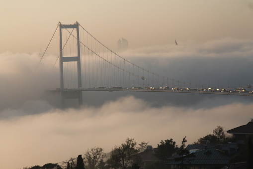Bosphorus and Bosphorus Bridge stuck in fog, autumn weather, Bosphorus Bridge