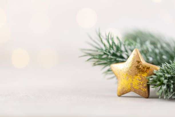 Christmas background with fir branches, decor on bohek background.