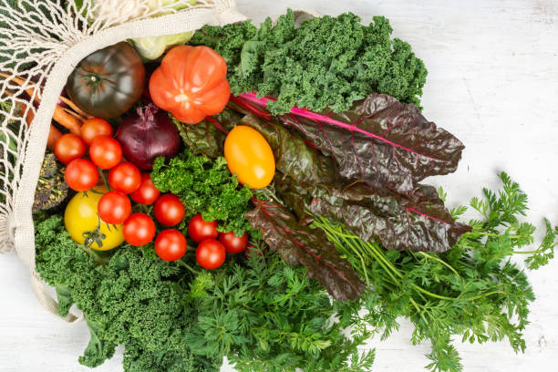 istock Variety of organic vegetables on white table 1433195823