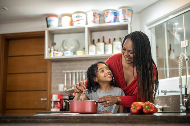 istock Mother and daughter cooking 1433197059