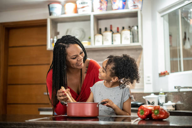 istock Mother and daughter cooking 1433197061