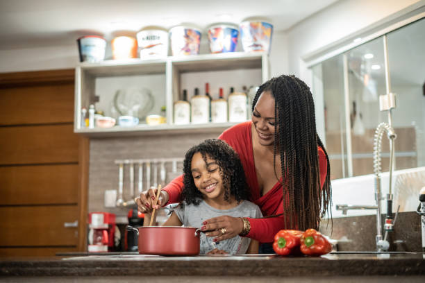 istock Mother and daughter cooking 1433197070