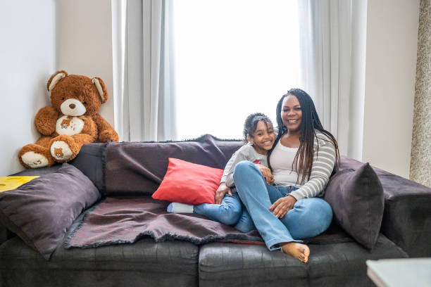 istock Mother  and daughter watching tv 1433197222