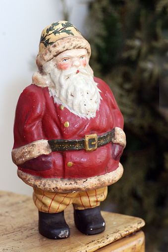 Vintage Santa statue brings old fashioned charm to Christmas decor.