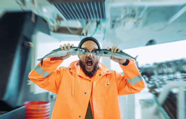 istock Fisherman with fish in front of his eyes 1433200321