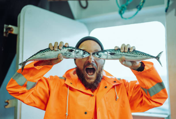 istock Fisherman with fish in front of his eyes 1433200324