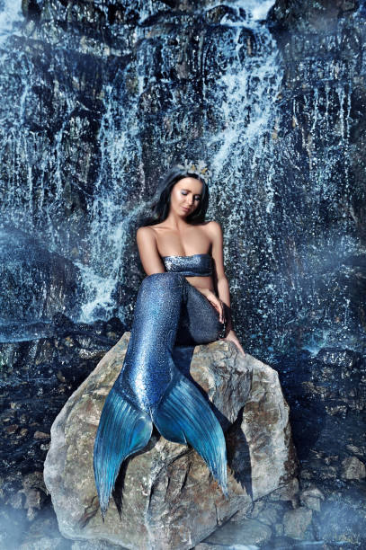 istock Pretty mermaid dreaming on the rock 1433202475