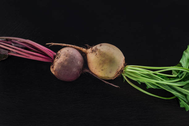 Beetroot on dark stone table. Top view. Vegetarian food concept.