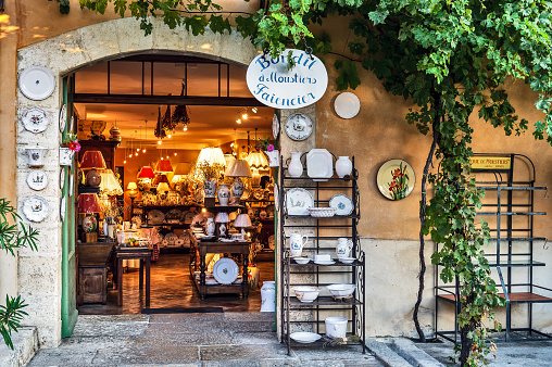 Europe, France, Alpes-de-Haute-Provence, Regional Natural Park of Verdon. Moustiers-Sainte-Marie, labeled The Most Beautiful Villages of France. Shop front selling earthenware of Moustiers