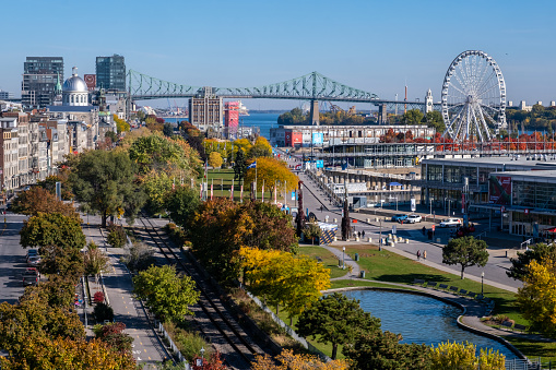 Montreal, CA - 11 October 2022: Aerial view of the Old Port of Montreal, with Ferris Wheel, Jacques Cartier Bridge and Bonsecours Market