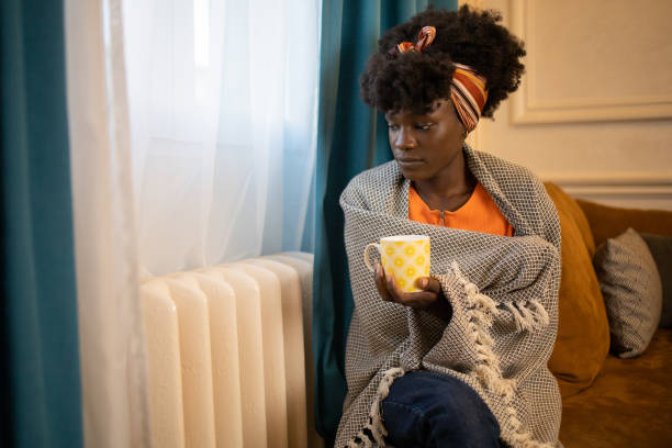 istock Woman feel cold in home with no heating 1433218054