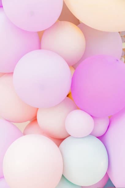 istock pink, beige and light green balloons. 1433218121