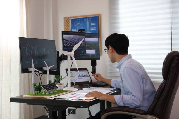istock Young smart engineer design Green energy project, engineer design wind turbine and solar system at home , freelance engineer 1433224626