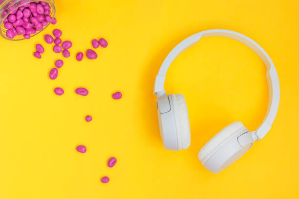 istock relax concept. modern white wireless headphones on yellow background 1433224649