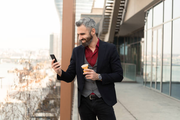istock Portrait of a businessman on a coffee break using smartphone 1433224792