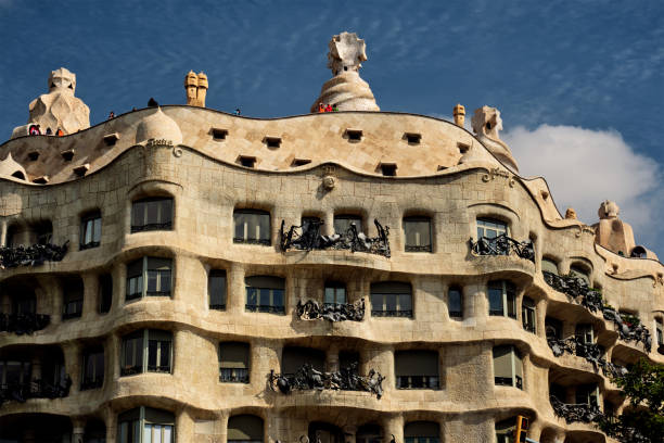 Barcelona, Spain - April 15, 2019: Famous Casa Mila house know as La Pedrera modernist building in Barcelona, Catalonia, Spain designed by architect Antoni Gaudi